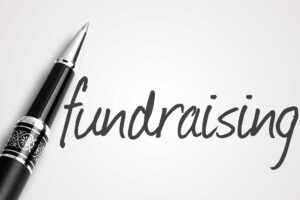 Image of a pen and the word fundraising