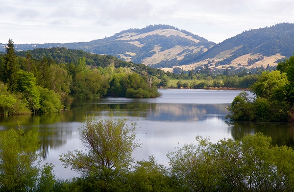 Spring Lake Regional Park with view of lake and surrounding hills