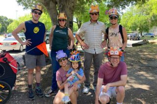Family and kids wearing decorated helmets at Child in the Wild
