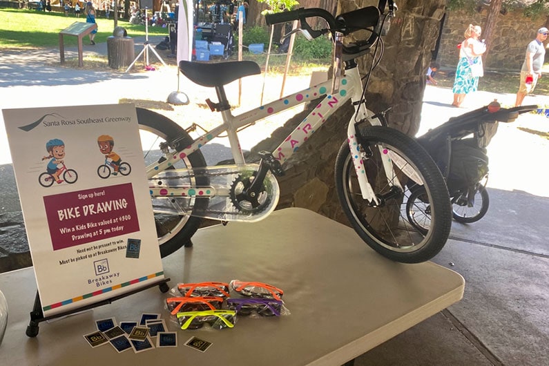 Southeaset Greenway bike raffle with bike on table top