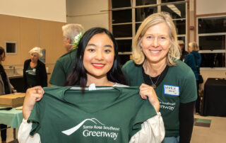 Elly Somnavong, student in ArtSY program through Sonoma Land Trust standing with Mary Pierce, Campaign Volunteer