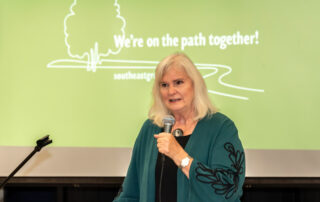 City of Santa Rosa Supervisor, Susan Gorin standing in front of presentation at Montgomery High School