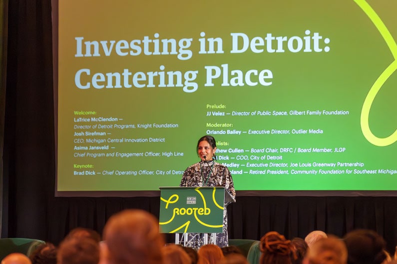 Photo of woman presenting at Rooted conference