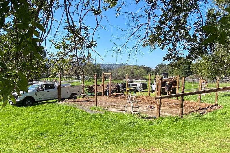 Photo of city truck and barn pad where structure had stood