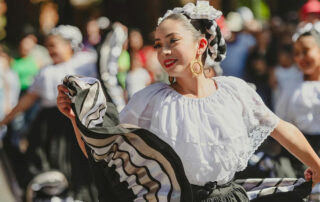 Woman dancing in Grupo Folklorico Quetzalen