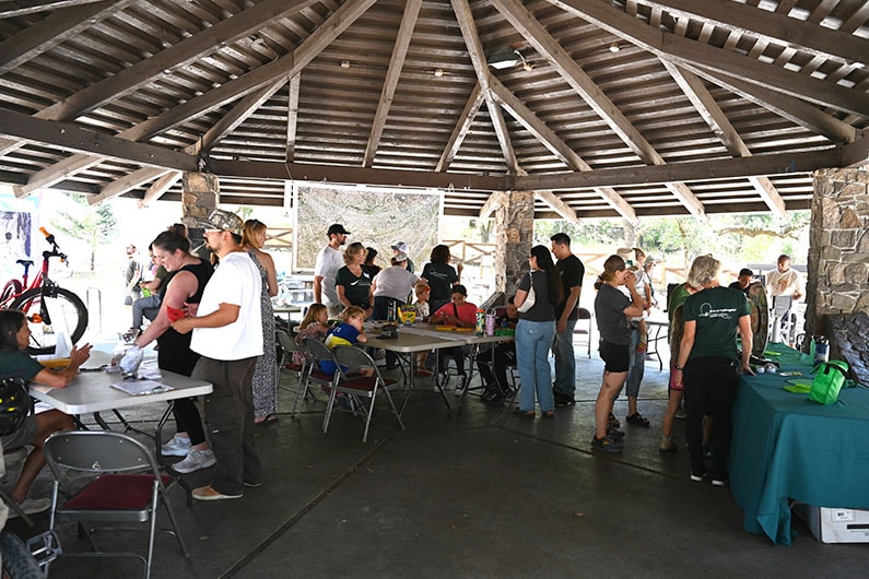 Southeast Greenway pavilion at Howarth Park with volunteers and families