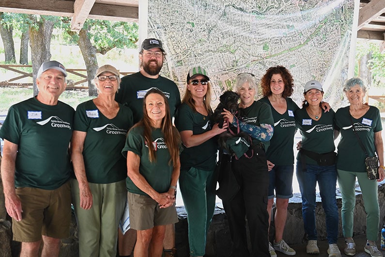 Southeast Greenway Volunteers wearing green logo shirts