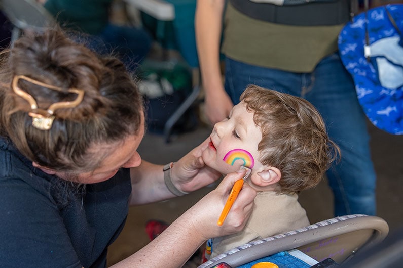 Child getting face painted